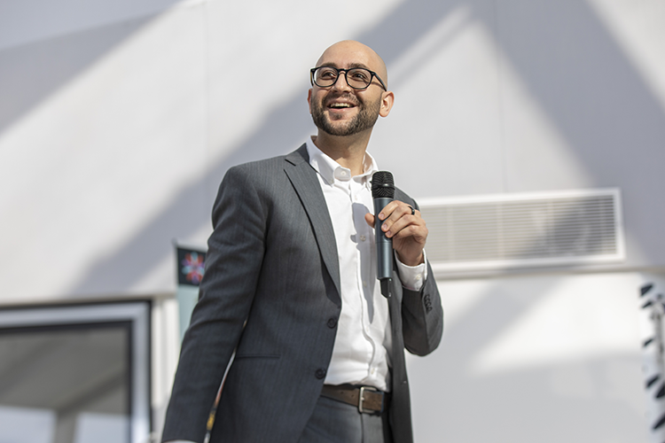 Wilhelm Klein speaking at Tech Nation Rising Stars event in London, holding a microphone.