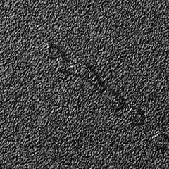Asphalt surface with a synthetic dent defect.